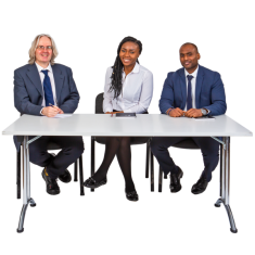 Three people sitting at a desk